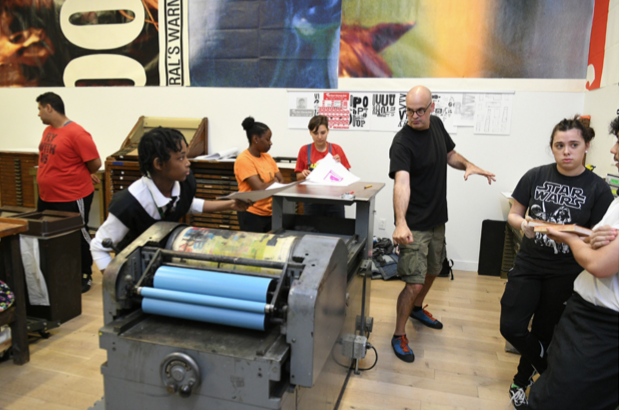 Pictured: Prof. Ned Drew engaging with high school students at Express Newark